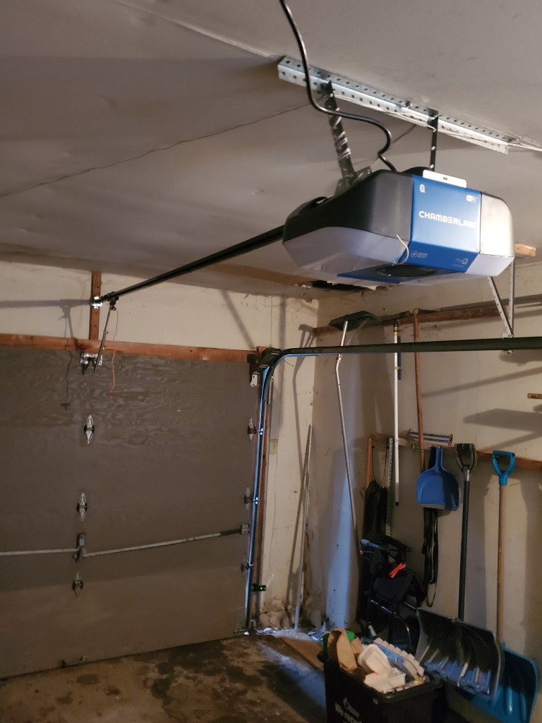Chamberlain garage door opener on a garage ceiling — vacation security checklist Ottawa